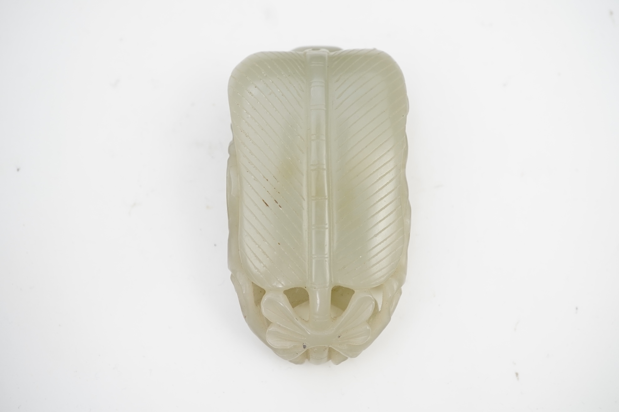 A Chinese pale celadon jade carving of Sun Wukong, the Monkey King, 18th/19th century